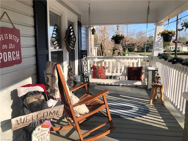 wooden deck featuring covered porch