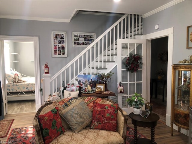 living room featuring crown molding and hardwood / wood-style floors