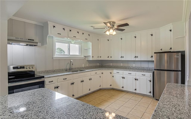 4249 High Point Rd, Winston-Salem, NC 27107 - kitchen with under cabinet range hood, appliances with stainless steel finishes, a ceiling fan, light tile patterned floors, and white cabinetry