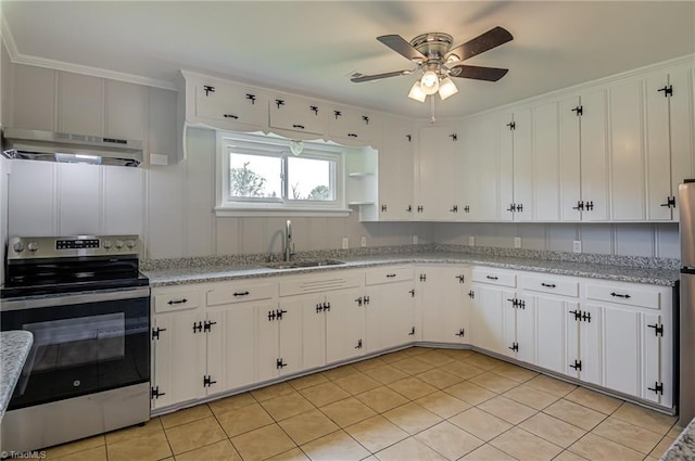 4249 High Point Rd, Winston-Salem, NC 27107 - kitchen with electric range, under cabinet range hood, a ceiling fan, white cabinets, and ornamental molding