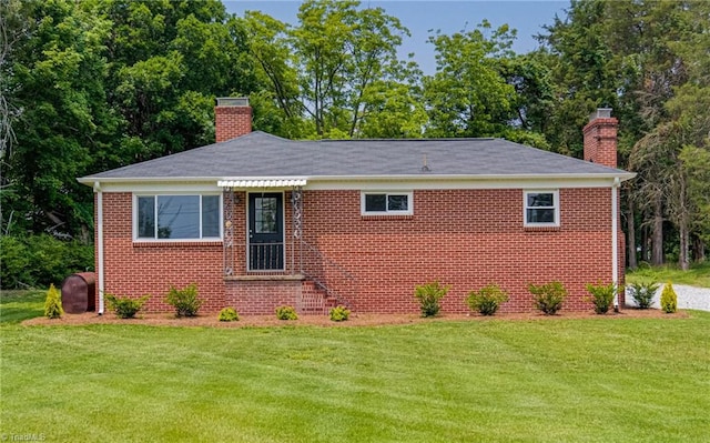 4249 High Point Rd, Winston-Salem, NC 27107 - view of front of home with a chimney, a front lawn, and brick siding