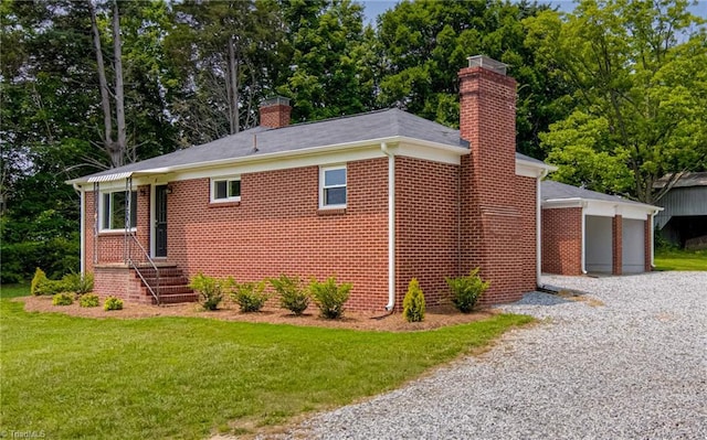 4249 High Point Rd, Winston-Salem, NC 27107 - view of front of property with a chimney, a front lawn, brick siding, and a garage