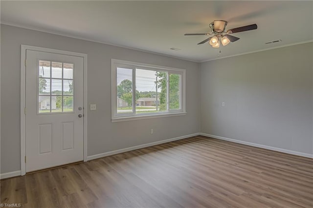 4249 High Point Rd, Winston-Salem, NC 27107 - foyer entrance featuring ornamental molding, wood finished floors, and ceiling fan