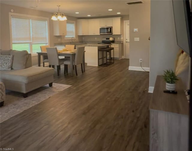 815 Martin Luther King Jr Ave, Salisbury, NC 28144 - living area featuring a chandelier, dark wood-type flooring, baseboards, and recessed lighting