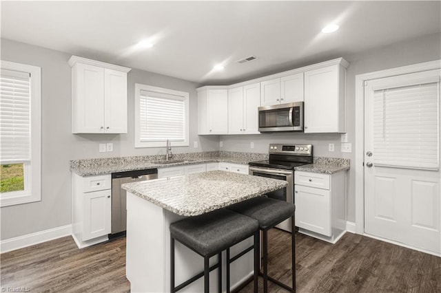 815 Martin Luther King Jr Ave, Salisbury, NC 28144 - kitchen featuring stainless steel appliances, a sink, dark wood finished floors, white cabinetry, and recessed lighting