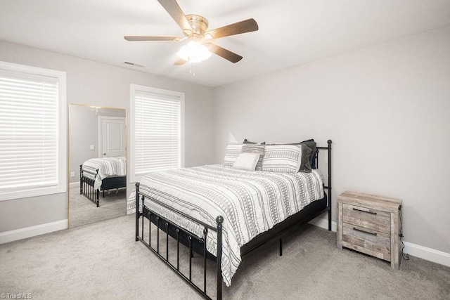 815 Martin Luther King Jr Ave, Salisbury, NC 28144 - bedroom featuring light colored carpet, baseboards, a ceiling fan, and multiple windows