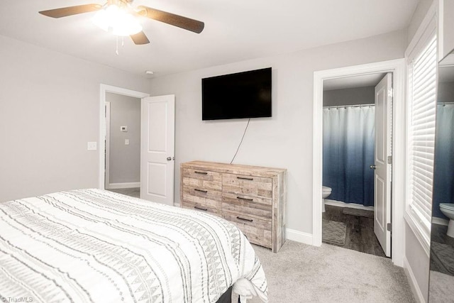 815 Martin Luther King Jr Ave, Salisbury, NC 28144 - bedroom featuring light colored carpet, a ceiling fan, connected bathroom, and baseboards