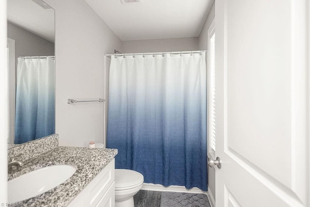 815 Martin Luther King Jr Ave, Salisbury, NC 28144 - bathroom with vanity, toilet, and curtained shower