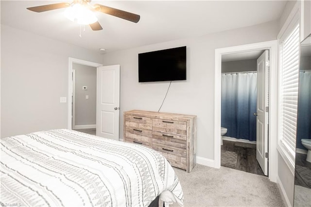 815 Martin Luther King Jr Ave, Salisbury, NC 28144 - bedroom featuring light colored carpet, ceiling fan, baseboards, and ensuite bath