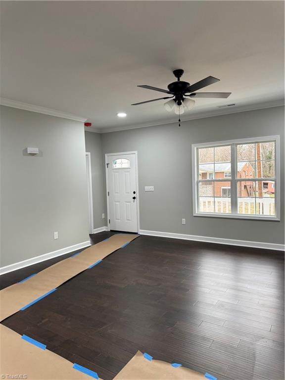 foyer with crown molding, ceiling fan, and hardwood / wood-style flooring