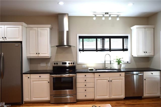 5170 Tabernacle School Rd, Asheboro, NC 27205 - kitchen featuring appliances with stainless steel finishes, wall chimney exhaust hood, white cabinetry, dark countertops, and recessed lighting