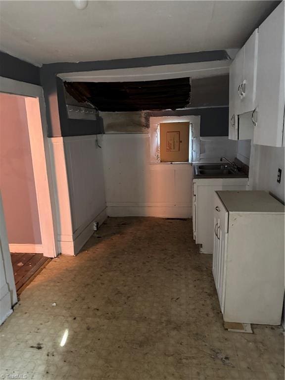 kitchen with sink and white cabinetry