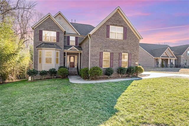 front facade with a yard