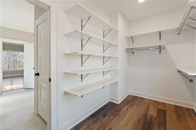 spacious closet with wood finished floors