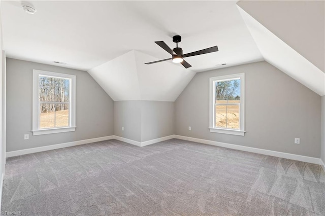 bonus room with vaulted ceiling, carpet, baseboards, and visible vents