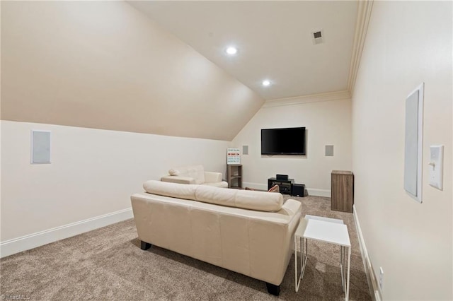 home theater with carpet floors, vaulted ceiling, and ornamental molding