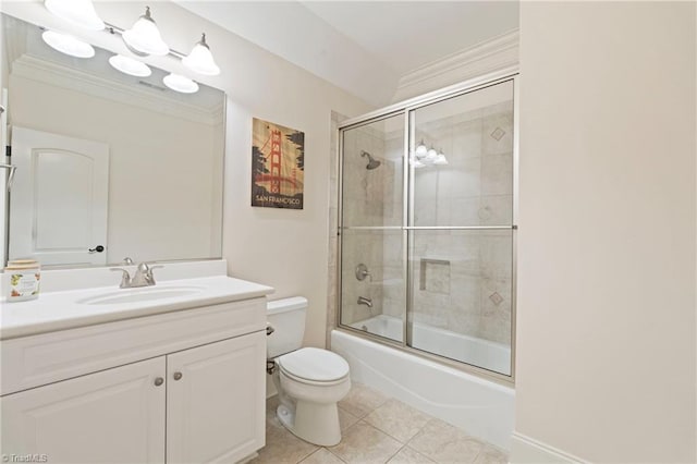 full bathroom with tile patterned flooring, shower / bath combination with glass door, crown molding, toilet, and vanity