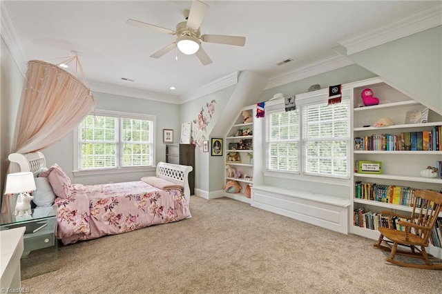 carpeted bedroom with ceiling fan and crown molding