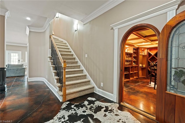 interior space featuring crown molding, beamed ceiling, and coffered ceiling