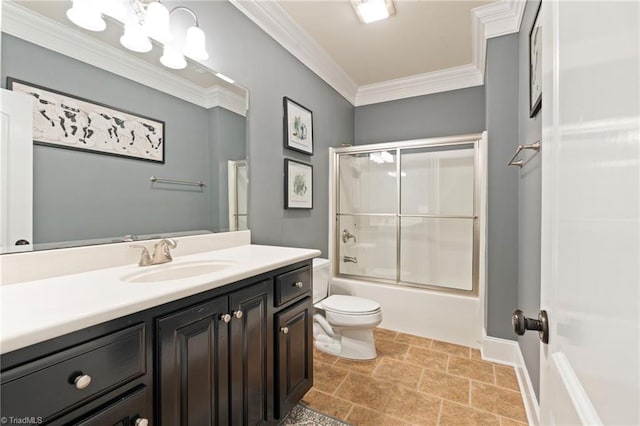 full bathroom with tile patterned flooring, crown molding, toilet, vanity, and combined bath / shower with glass door