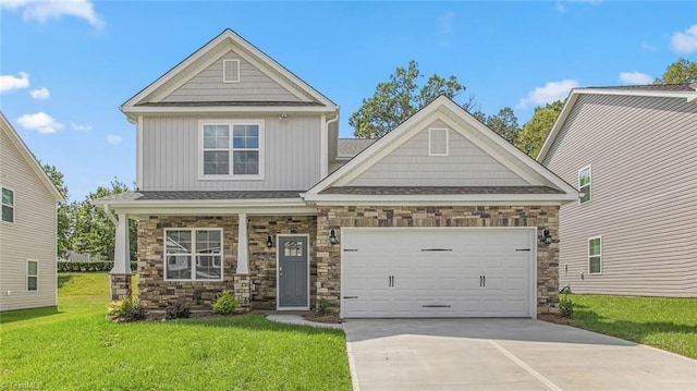 craftsman-style home featuring board and batten siding, concrete driveway, a garage, and a front lawn