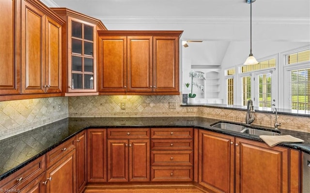 7103 Ludgate Rd, Gibsonville, NC 27249 - kitchen with decorative light fixtures, dark stone countertops, tasteful backsplash, glass insert cabinets, and lofted ceiling