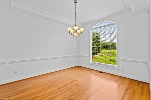 7103 Ludgate Rd, Gibsonville, NC 27249 - unfurnished room with ornamental molding, light wood-type flooring, and a chandelier