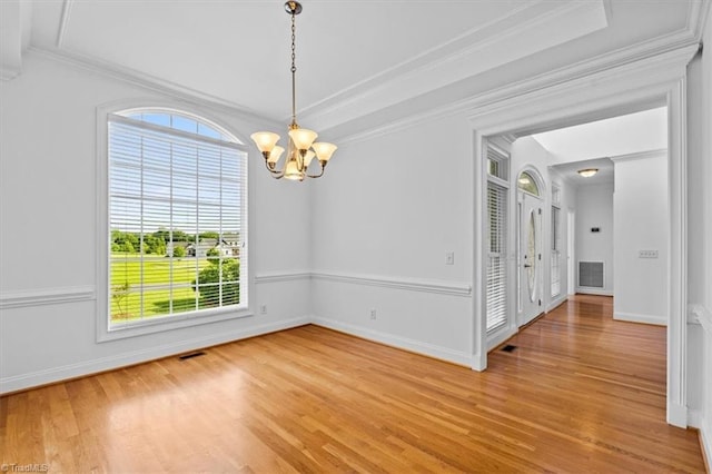 7103 Ludgate Rd, Gibsonville, NC 27249 - unfurnished room featuring light wood finished floors, a chandelier, and crown molding