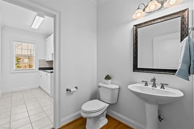 7103 Ludgate Rd, Gibsonville, NC 27249 - half bath featuring ornamental molding and decorative backsplash