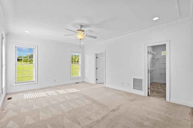 7103 Ludgate Rd, Gibsonville, NC 27249 - unfurnished bedroom with ornamental molding, multiple windows, carpet, a spacious closet, and recessed lighting
