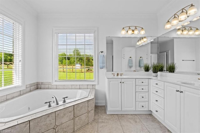 7103 Ludgate Rd, Gibsonville, NC 27249 - full bath featuring healthy amount of natural light, double vanity, a whirlpool tub, and crown molding