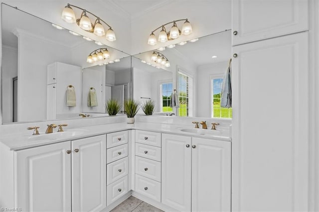 7103 Ludgate Rd, Gibsonville, NC 27249 - full bath featuring double vanity, ornamental molding, and tile patterned flooring