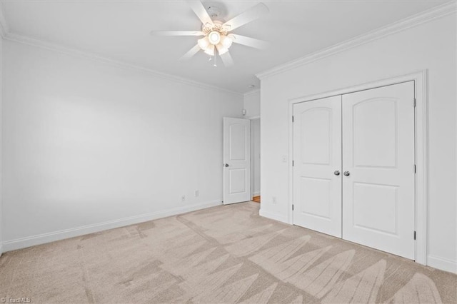 7103 Ludgate Rd, Gibsonville, NC 27249 - unfurnished bedroom with carpet, crown molding, a closet, and a ceiling fan