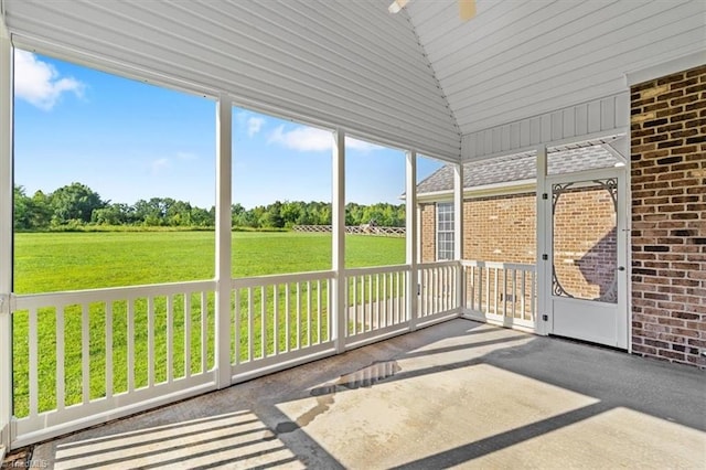 7103 Ludgate Rd, Gibsonville, NC 27249 - unfurnished sunroom with vaulted ceiling and ceiling fan