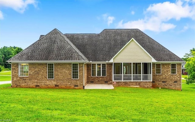 7103 Ludgate Rd, Gibsonville, NC 27249 - rear view of house with crawl space, a patio area, brick siding, and a yard