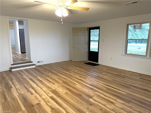 856 Haynes Rd, Elkin, NC 28621 - spare room featuring wood finished floors, a ceiling fan, baseboards, and ornamental molding