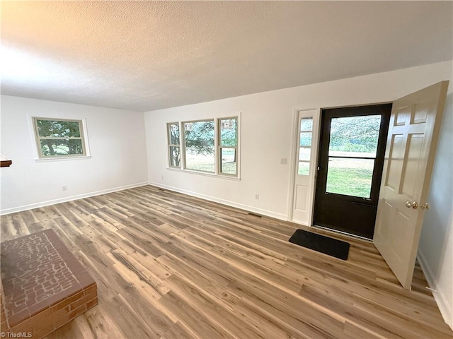 856 Haynes Rd, Elkin, NC 28621 - entryway featuring a textured ceiling, wood finished floors, and baseboards