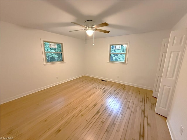 856 Haynes Rd, Elkin, NC 28621 - empty room featuring light wood-type flooring, a ceiling fan, and baseboards