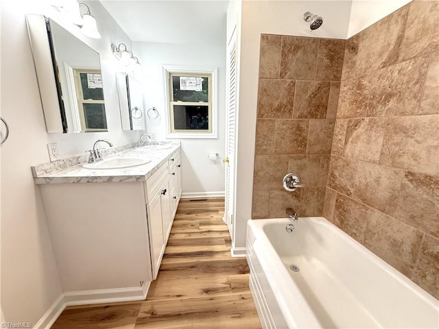 856 Haynes Rd, Elkin, NC 28621 - bathroom featuring wood finished floors, double vanity, shower / washtub combination, and baseboards