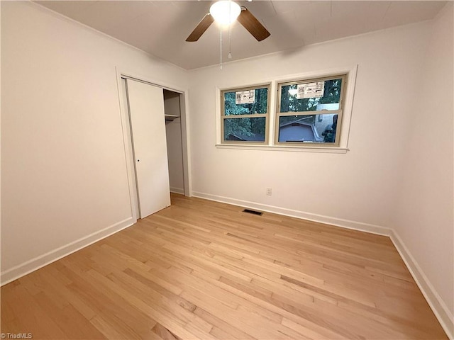 856 Haynes Rd, Elkin, NC 28621 - unfurnished bedroom with light wood finished floors, a closet, baseboards, and a ceiling fan