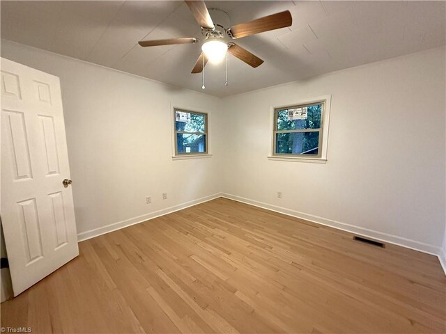 856 Haynes Rd, Elkin, NC 28621 - unfurnished room with light wood-style flooring, baseboards, and a ceiling fan