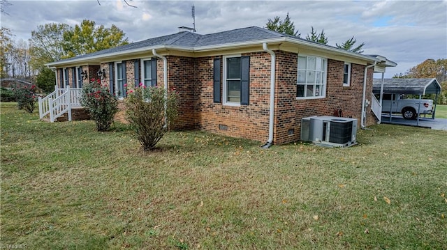 exterior space featuring a lawn, cooling unit, and a carport