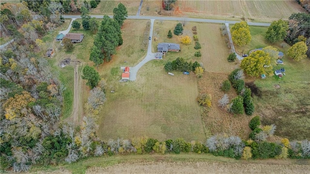 birds eye view of property with a rural view