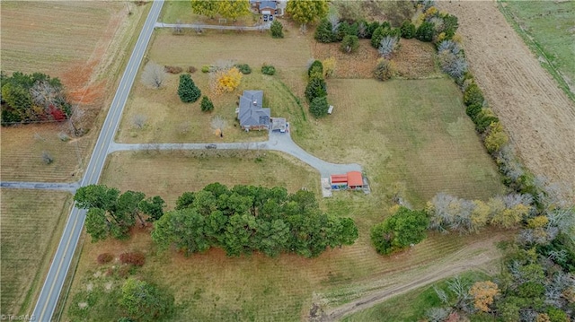 birds eye view of property with a rural view