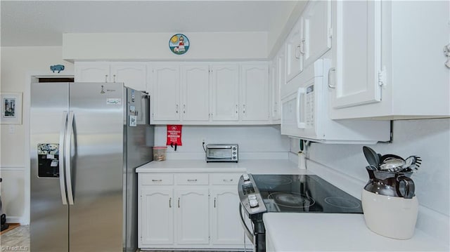 kitchen with white cabinetry, black electric range oven, and stainless steel fridge with ice dispenser