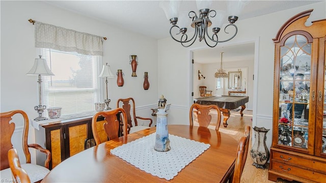 dining space with hardwood / wood-style floors and pool table
