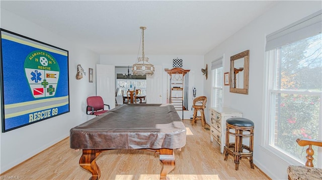 game room with light hardwood / wood-style floors and billiards