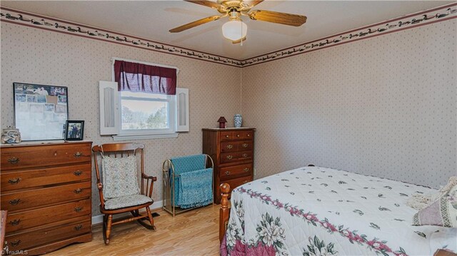 bedroom featuring hardwood / wood-style floors and ceiling fan