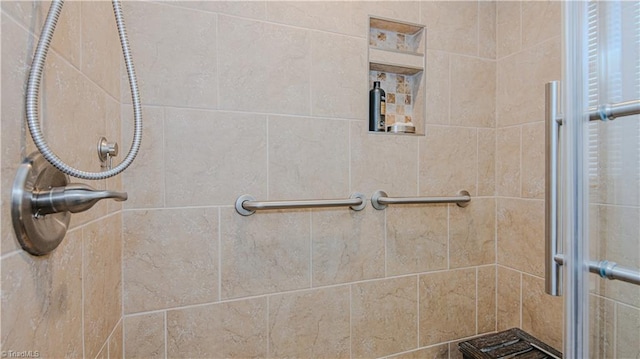bathroom with a shower with shower door