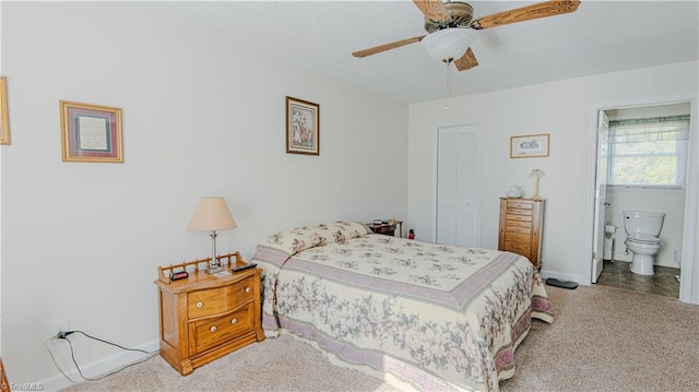carpeted bedroom with ceiling fan, connected bathroom, and a closet